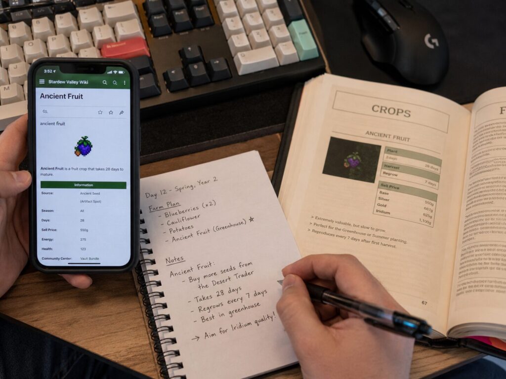 Player comparing Ancient Fruit details on a community wiki with a printed guide and handwritten notes.